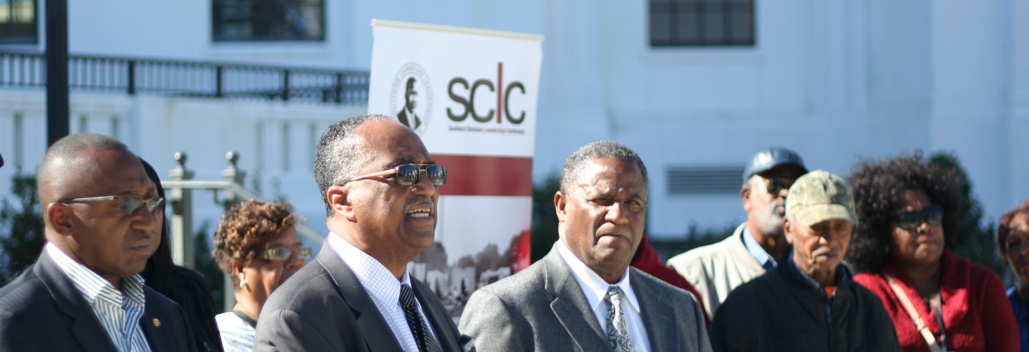 Greenetrack supporters, on his office steps, demand a meeting with attorney general