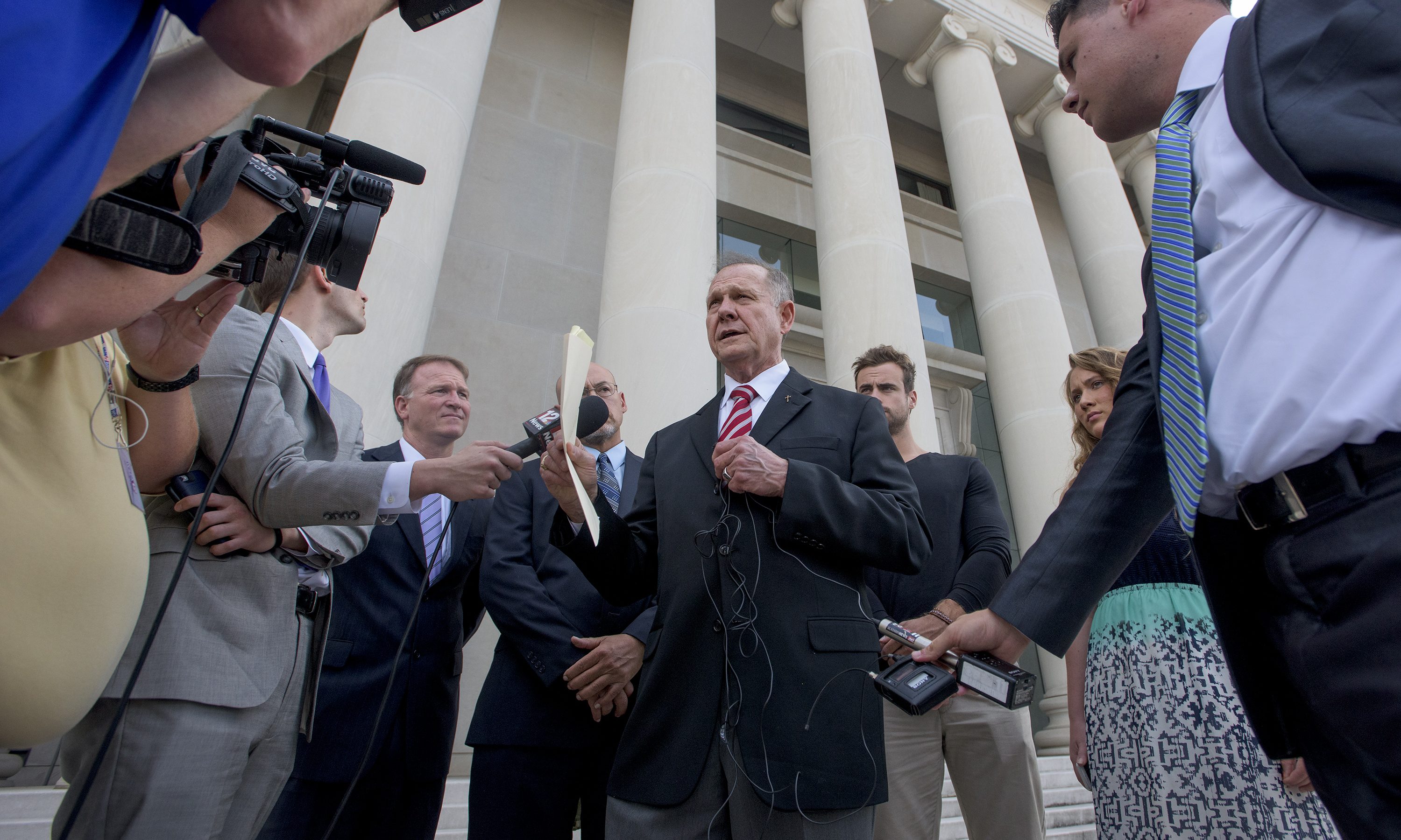 Roy Moore speaks to reporters and supporters