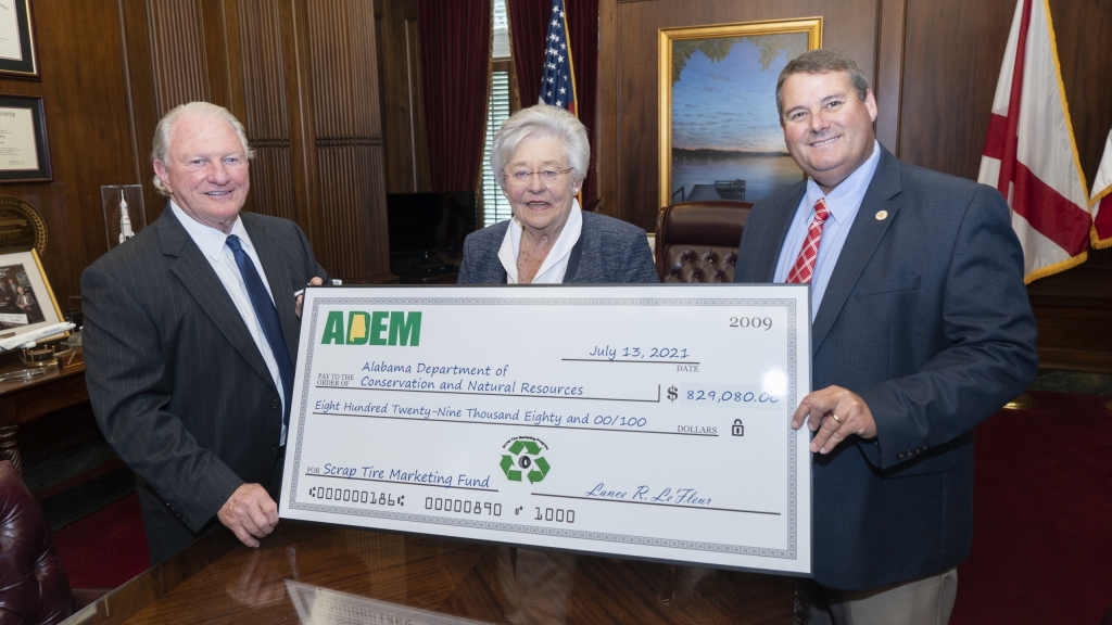 ADEM presents check to repave roads at two state parks with recycled tires