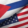 Cuba and United States flags together textile cloth, fabric texture