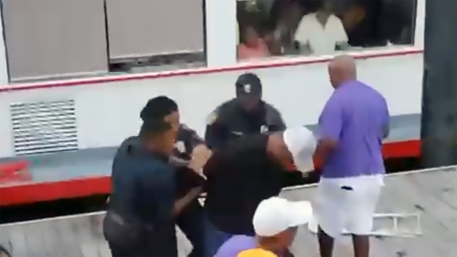 Montgomery brawl “chair man” arrested; allegations of racial slurs