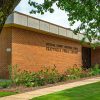 The exterior of the Prattville Public Library on a summer day.