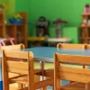 Chairs, table and toys. Interior of kindergarten.