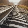 modern railway goes into foggy distance