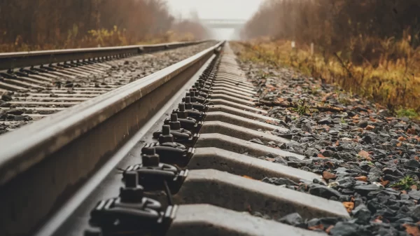 modern railway goes into foggy distance