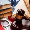 Gavel, books and handcuffs