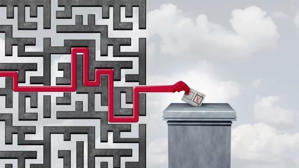 Voting challenges and election problem or voter suppression and campaign vote concept as ballots at a polling station as a maze blocking and disenfranchise a democratic right in a democracy