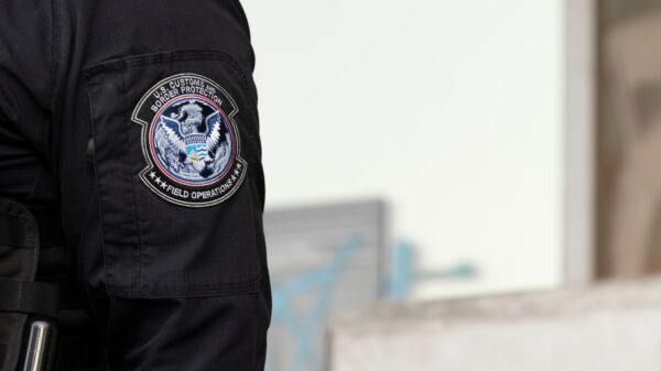 Los Angeles, California, USA - June 10, 2025: U.S. Customs and Border Protection (CBP) field officers guard a federal building during ICE deportation protests in Downtown LA.